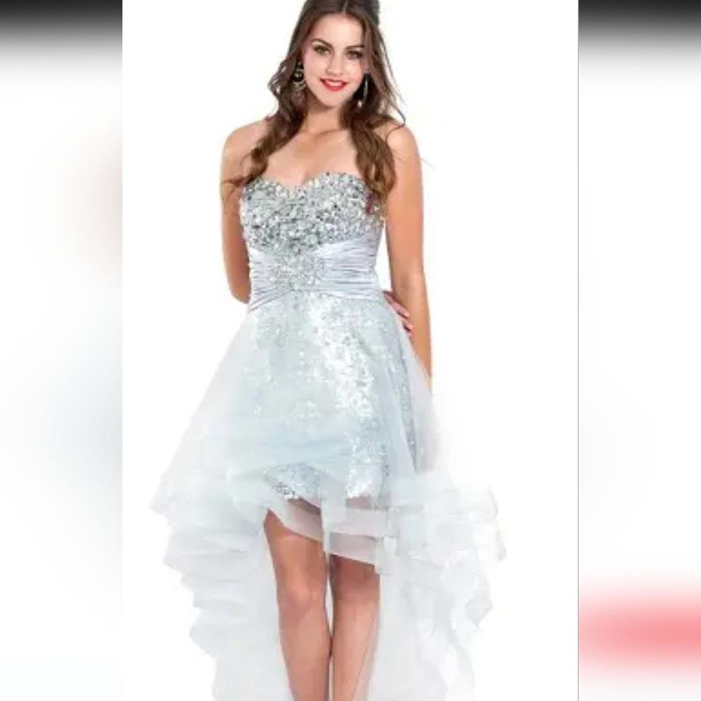Stunning silver sequin dress with sparkling rhinestone embellishment.